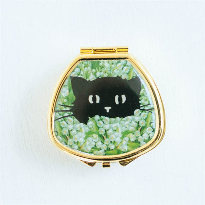 BLACK CAT IN LILY OF VALLEY