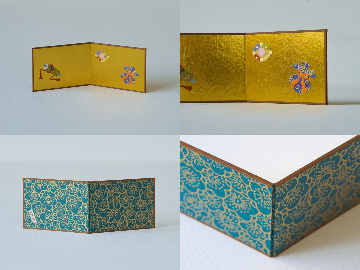 屏風／宝尽くし<br>
おめでたい宝巻、七宝、宝袋の切り絵をあしらった金屏風。